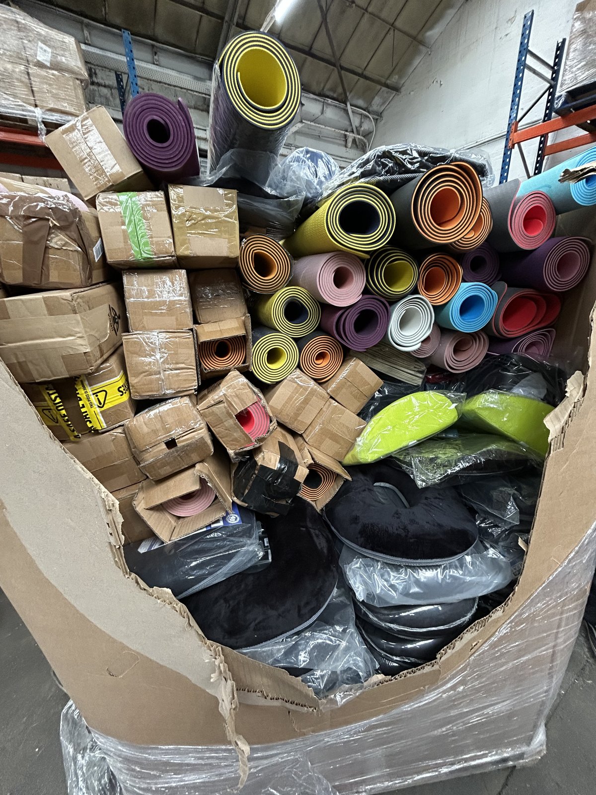 Pallet of Back Support Cushions and Yoga Mats